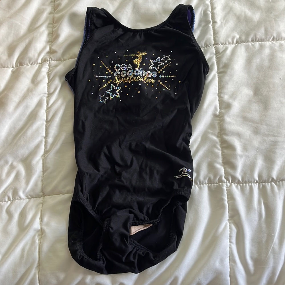Motionwear  gymnastics leo with an open back. In decent condition.
